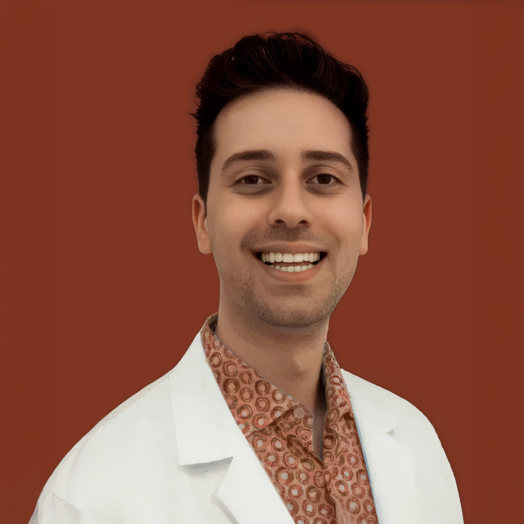 Dr. Sami Khaldieh, smiling optometrist wearing a white coat and patterned shirt, against a warm brown background.